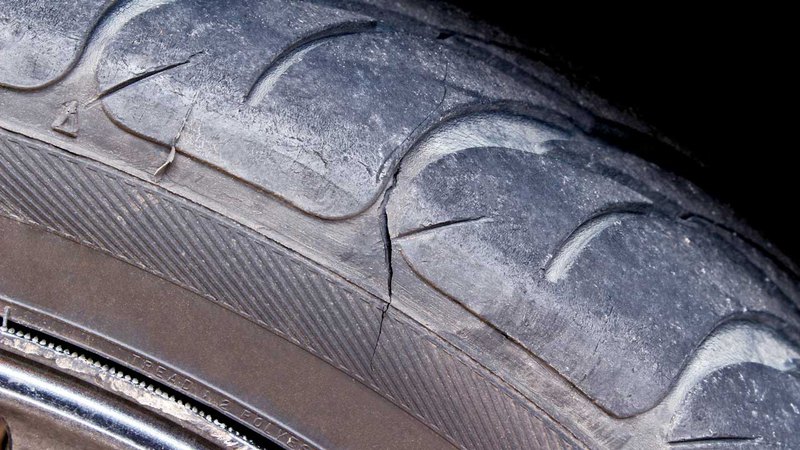 closeup of a damaged car tire; a specialist from Creamery can tell you how long do car tires last