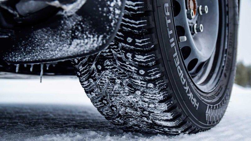 An ice-covered regular tire; do studded tires work?
